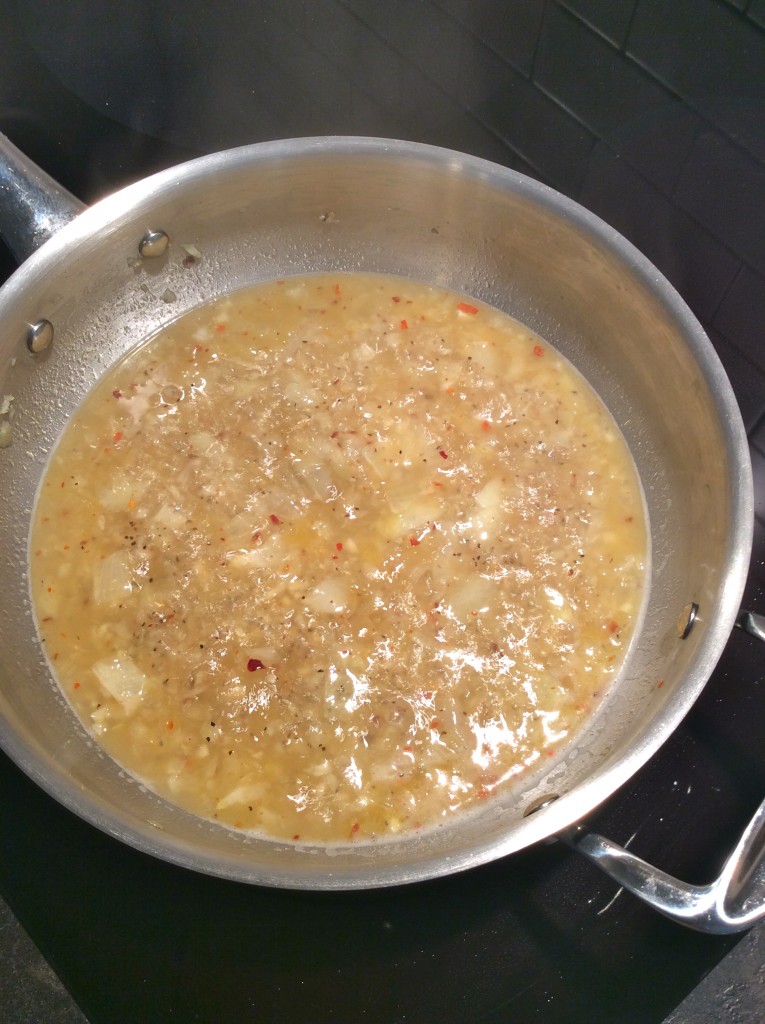 simmering onions, garlic, and vodka